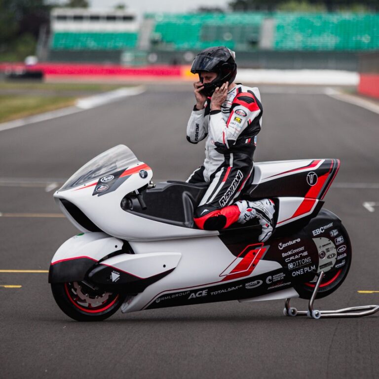 A person on a motorcycle Description automatically generated with low confidence