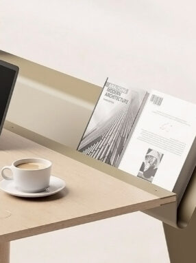 A computer and a cup of coffee on a table Description automatically generated with low confidence