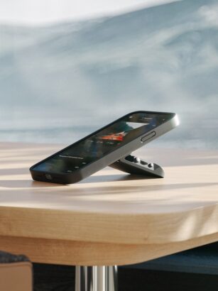 A cell phone on a table Description automatically generated with medium confidence