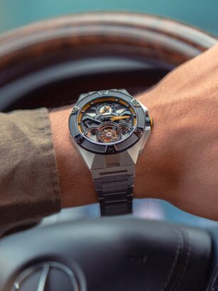 A person wearing a watch Description automatically generated with low confidence