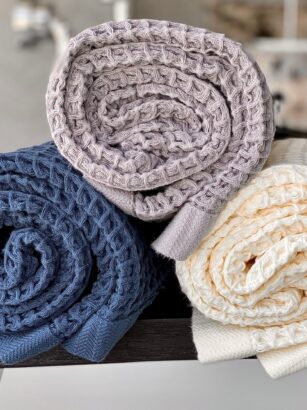 A picture containing hat, footwear, fabric Description automatically generated